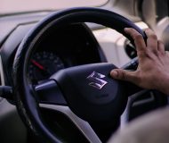 Learner driver taking a practical driving lesson in a Suzuki car how to choose the right driving instructor