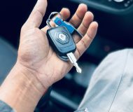 Person holding a Renault car key inside a vehicle dashboard how long does it take to get your Ps in NSW
