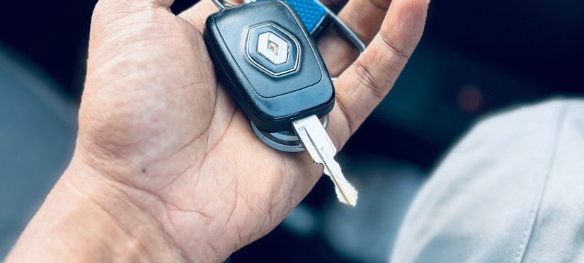 Person holding a Renault car key inside a vehicle dashboard how long does it take to get your Ps in NSW